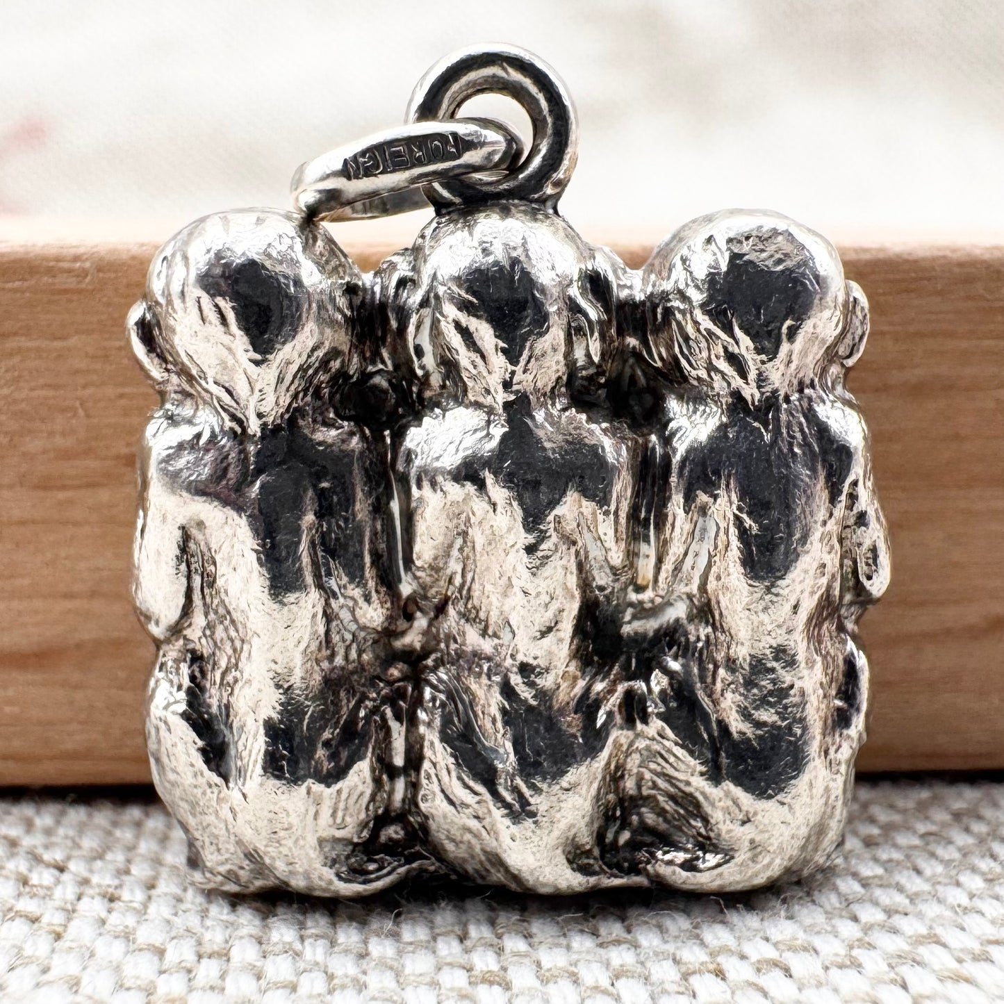 Vintage 'Three Wise Monkeys' silver pendant