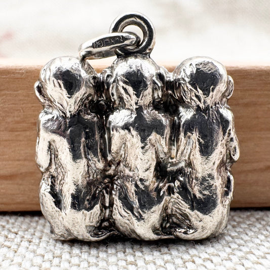 Vintage 'Three Wise Monkeys' silver pendant
