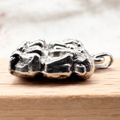 Vintage 'Three Wise Monkeys' silver pendant