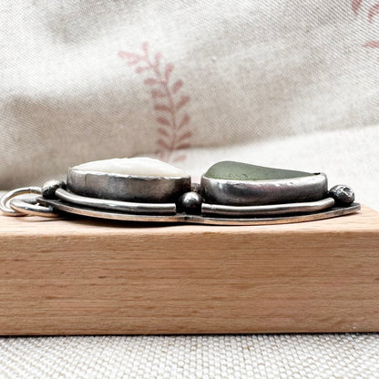 Sea glass & cowrie shell pendant by Smugglers Treasures, hallmarked Sheffield
