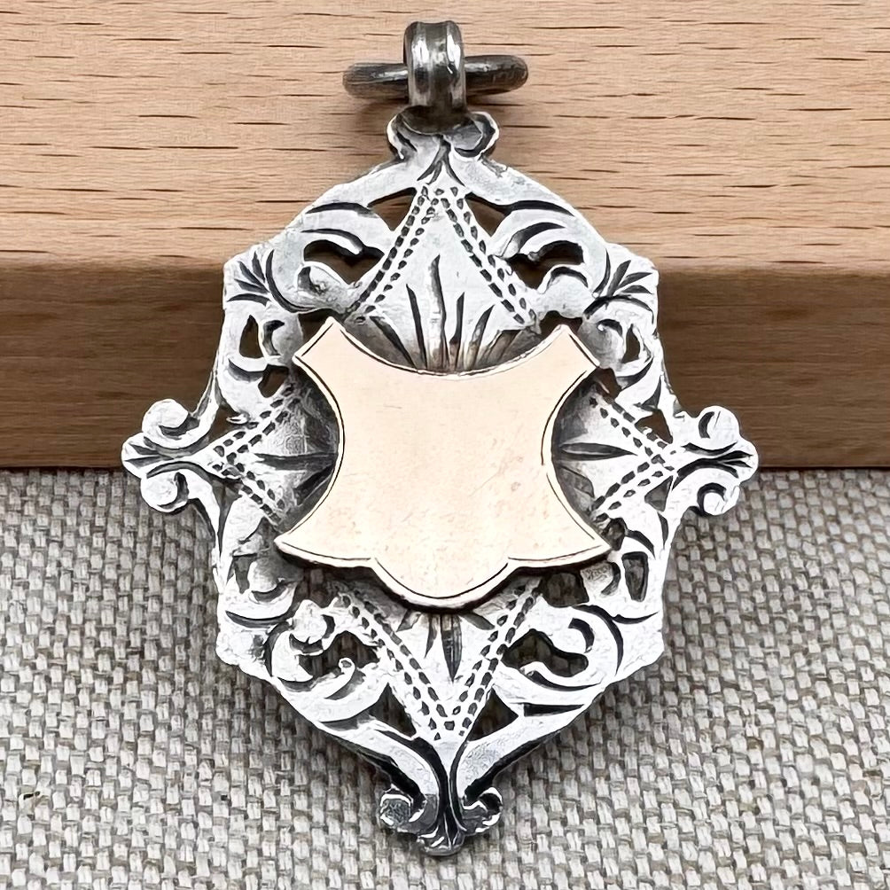 Antique Edwardian sterling silver and gilt medal fob pendant, hallmarked Birmingham 1909