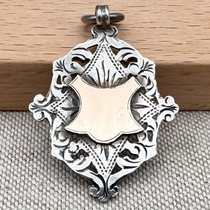 Antique Edwardian sterling silver and gilt medal fob pendant, hallmarked Birmingham 1909