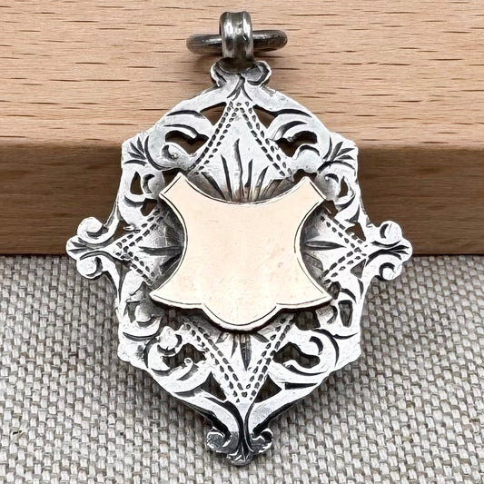 Antique Edwardian sterling silver and gilt medal fob pendant, hallmarked Birmingham 1909
