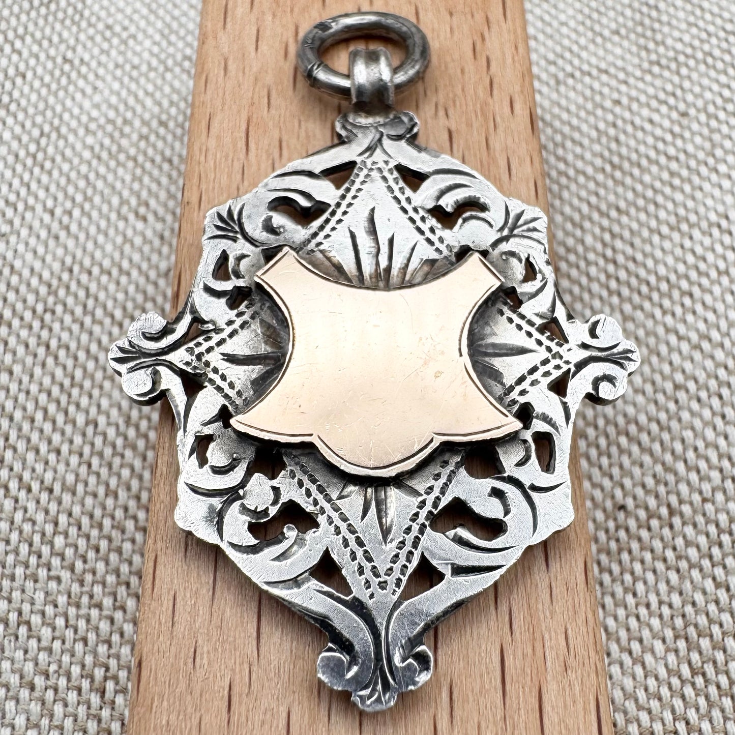Antique Edwardian sterling silver and gilt medal fob pendant, hallmarked Birmingham 1909