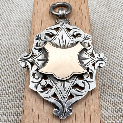 Antique Edwardian sterling silver and gilt medal fob pendant, hallmarked Birmingham 1909