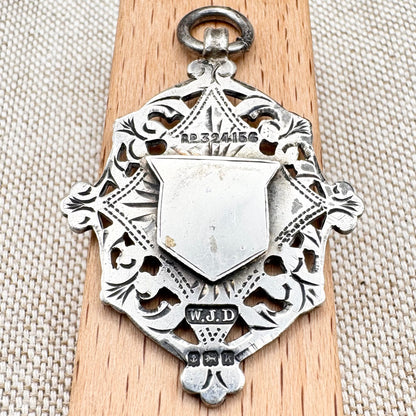Antique Edwardian sterling silver and gilt medal fob pendant, hallmarked Birmingham 1909