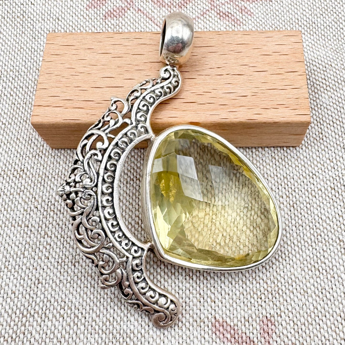 Citrine statement pendant with ornate openwork design