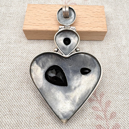 Vintage textured heart pendant with black onyx, articulated design