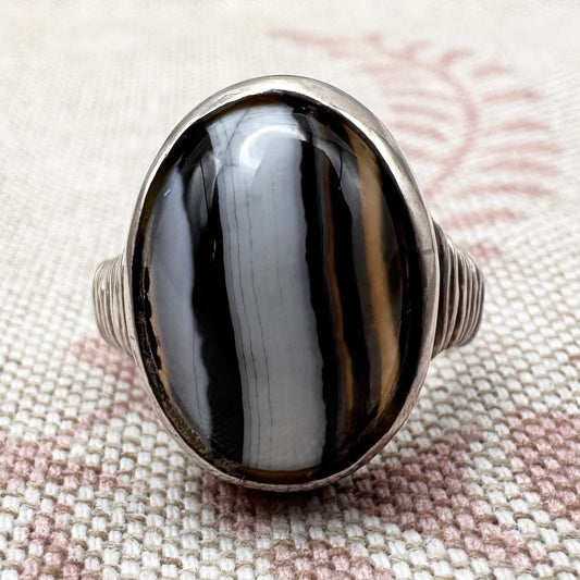 Black Botswana agate silver ring with coiled shoulders, size G.5 (US 3.5)
