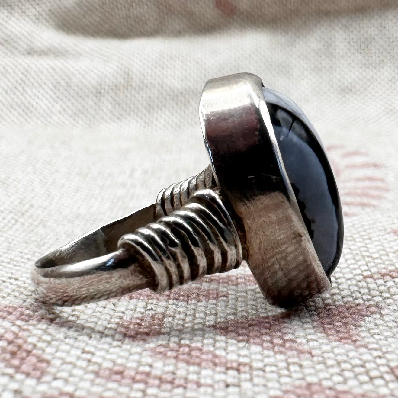 Black Botswana agate silver ring with coiled shoulders, size G.5 (US 3.5)