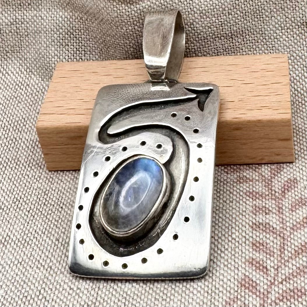 Large silver moonstone pendant with abstract arrow motif