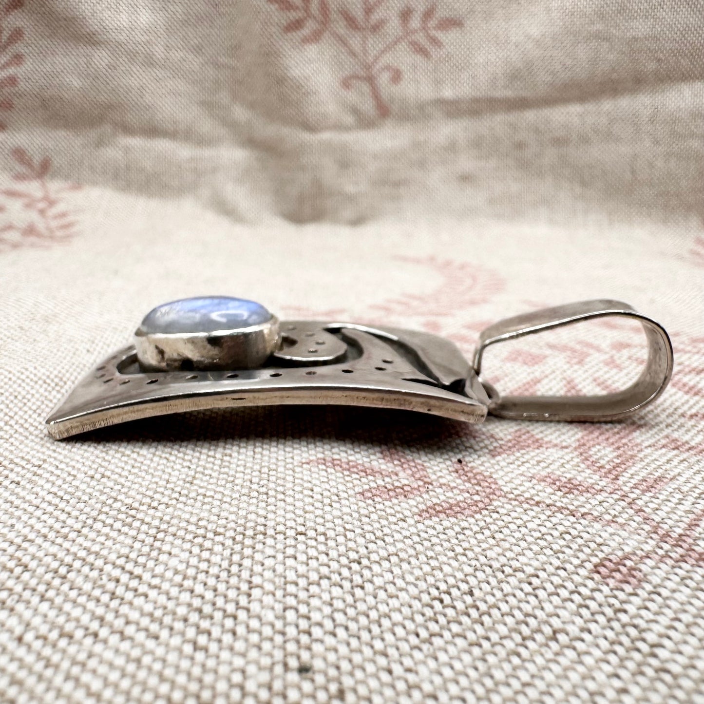 Large silver moonstone pendant with abstract arrow motif