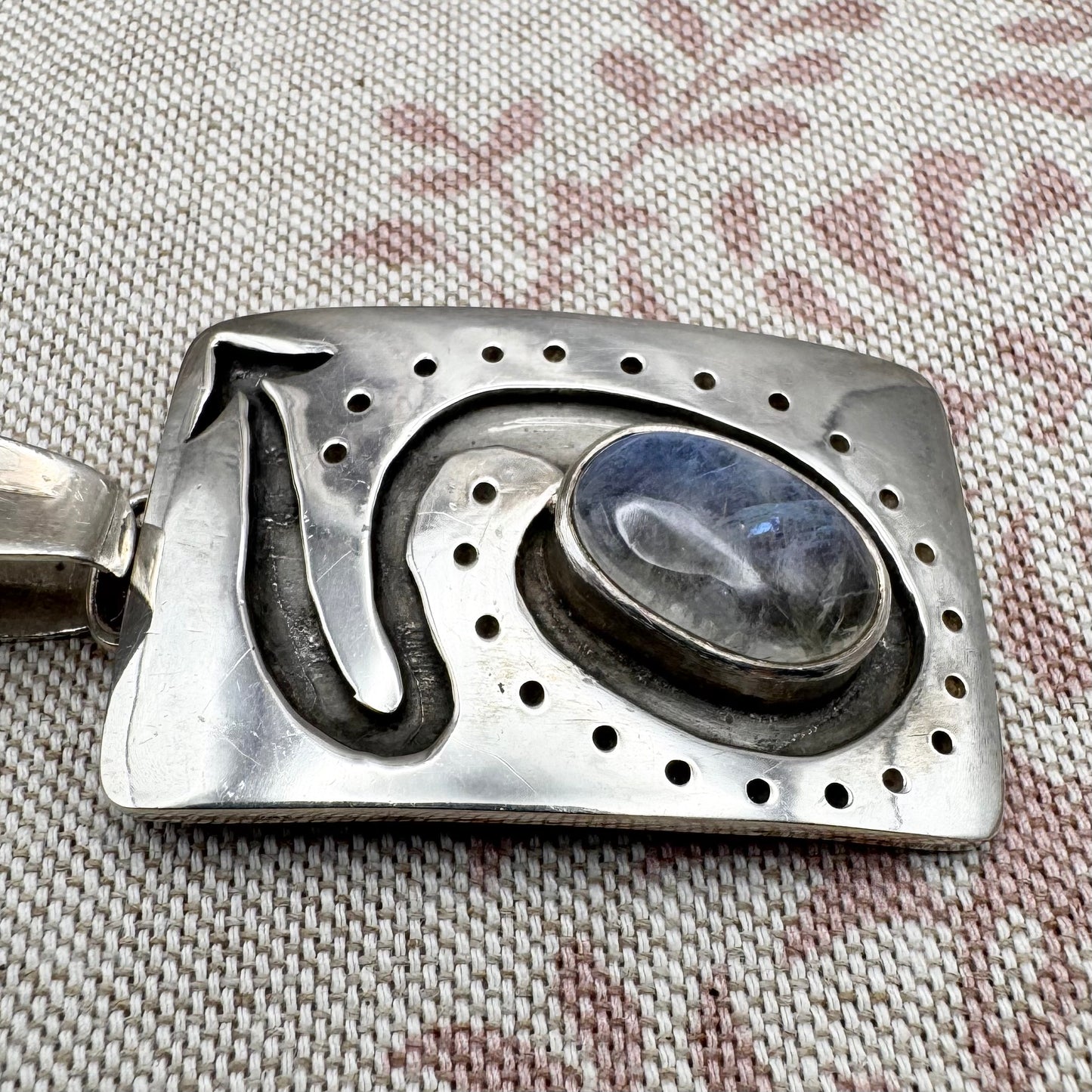 Large silver moonstone pendant with abstract arrow motif