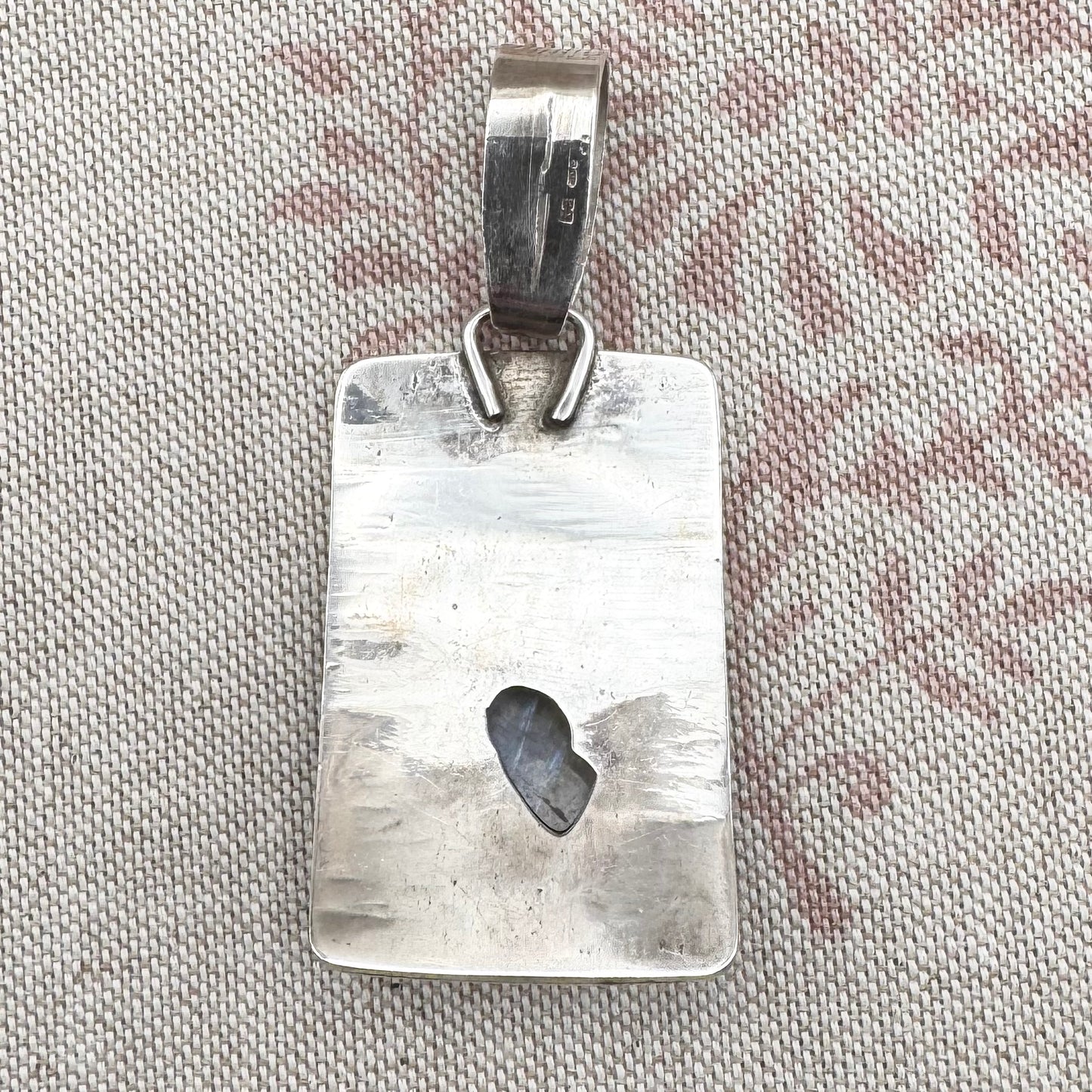 Large silver moonstone pendant with abstract arrow motif