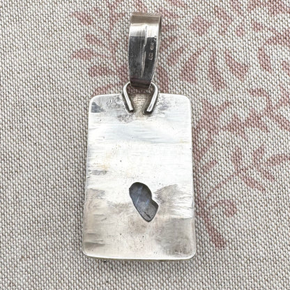 Large silver moonstone pendant with abstract arrow motif