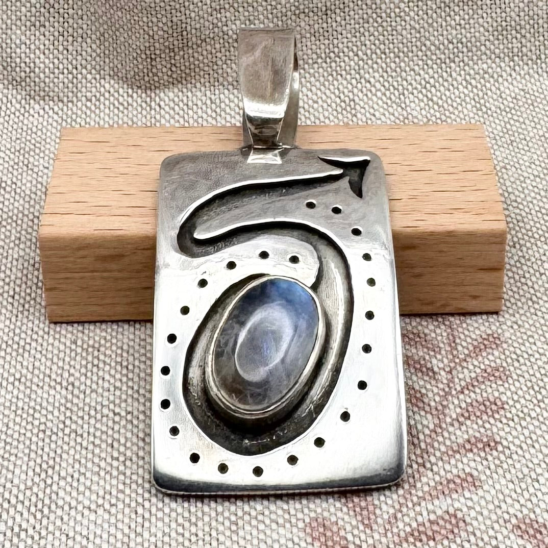 Large silver moonstone pendant with abstract arrow motif