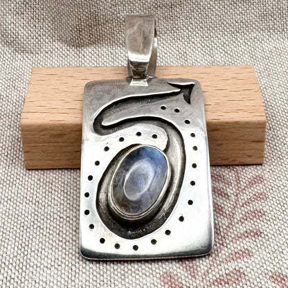 Large silver moonstone pendant with abstract arrow motif