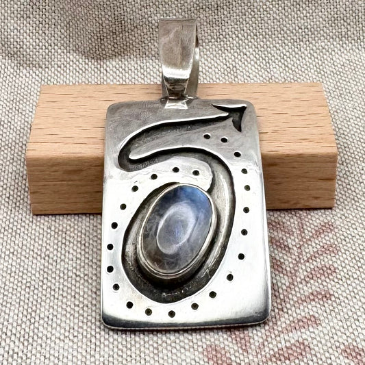 Large silver moonstone pendant with abstract arrow motif