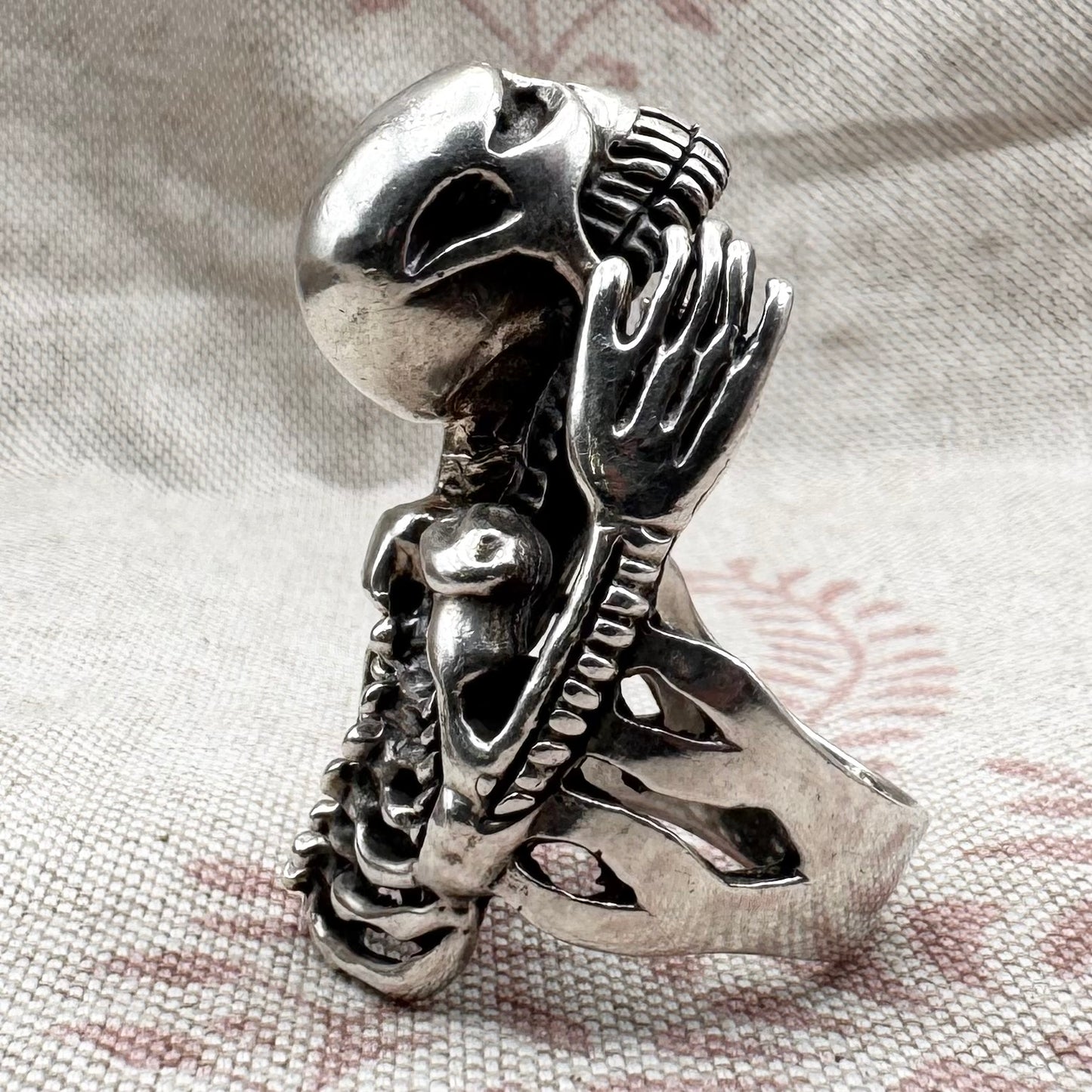 Skeleton ring with internal spine detail, size R (US 8.5) adjustable, hallmarked Birmingham