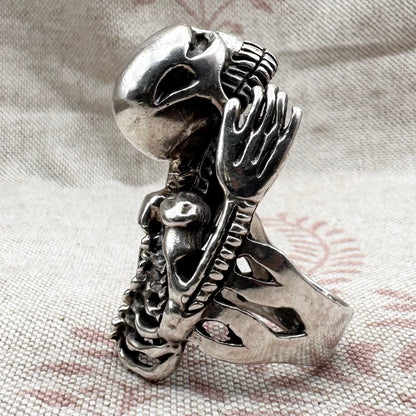 Skeleton ring with internal spine detail, size R (US 8.5) adjustable, hallmarked Birmingham