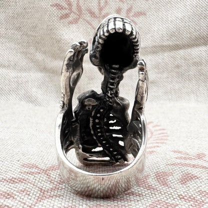 Skeleton ring with internal spine detail, size R (US 8.5) adjustable, hallmarked Birmingham