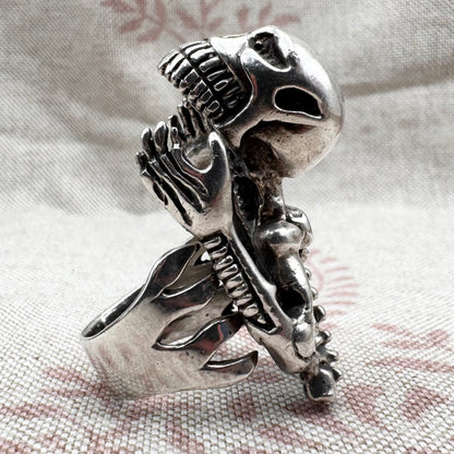 Skeleton ring with internal spine detail, size R (US 8.5) adjustable, hallmarked Birmingham