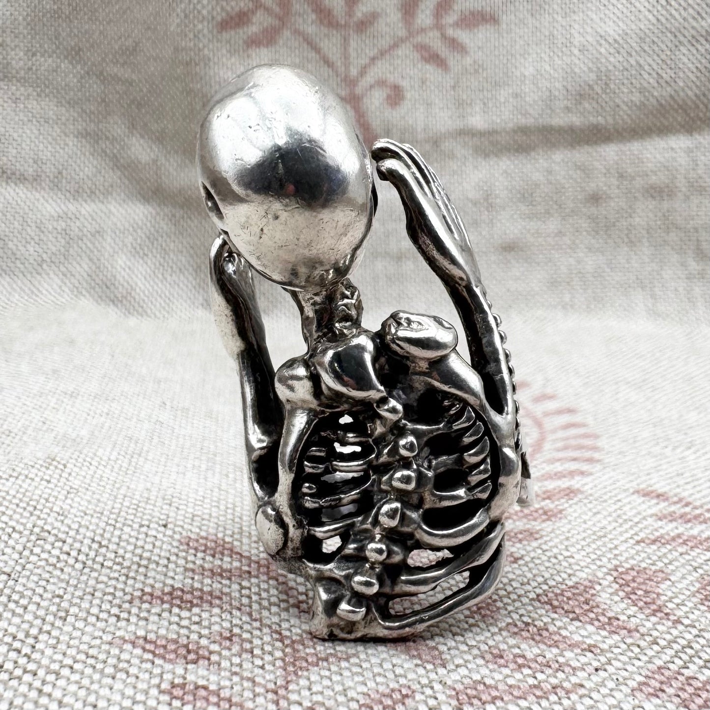 Skeleton ring with internal spine detail, size R (US 8.5) adjustable, hallmarked Birmingham