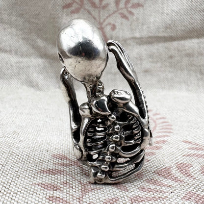 Skeleton ring with internal spine detail, size R (US 8.5) adjustable, hallmarked Birmingham