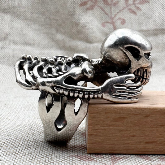 Skeleton ring with internal spine detail, size R (US 8.5) adjustable, hallmarked Birmingham