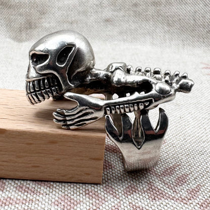 Skeleton ring with internal spine detail, size R (US 8.5) adjustable, hallmarked Birmingham