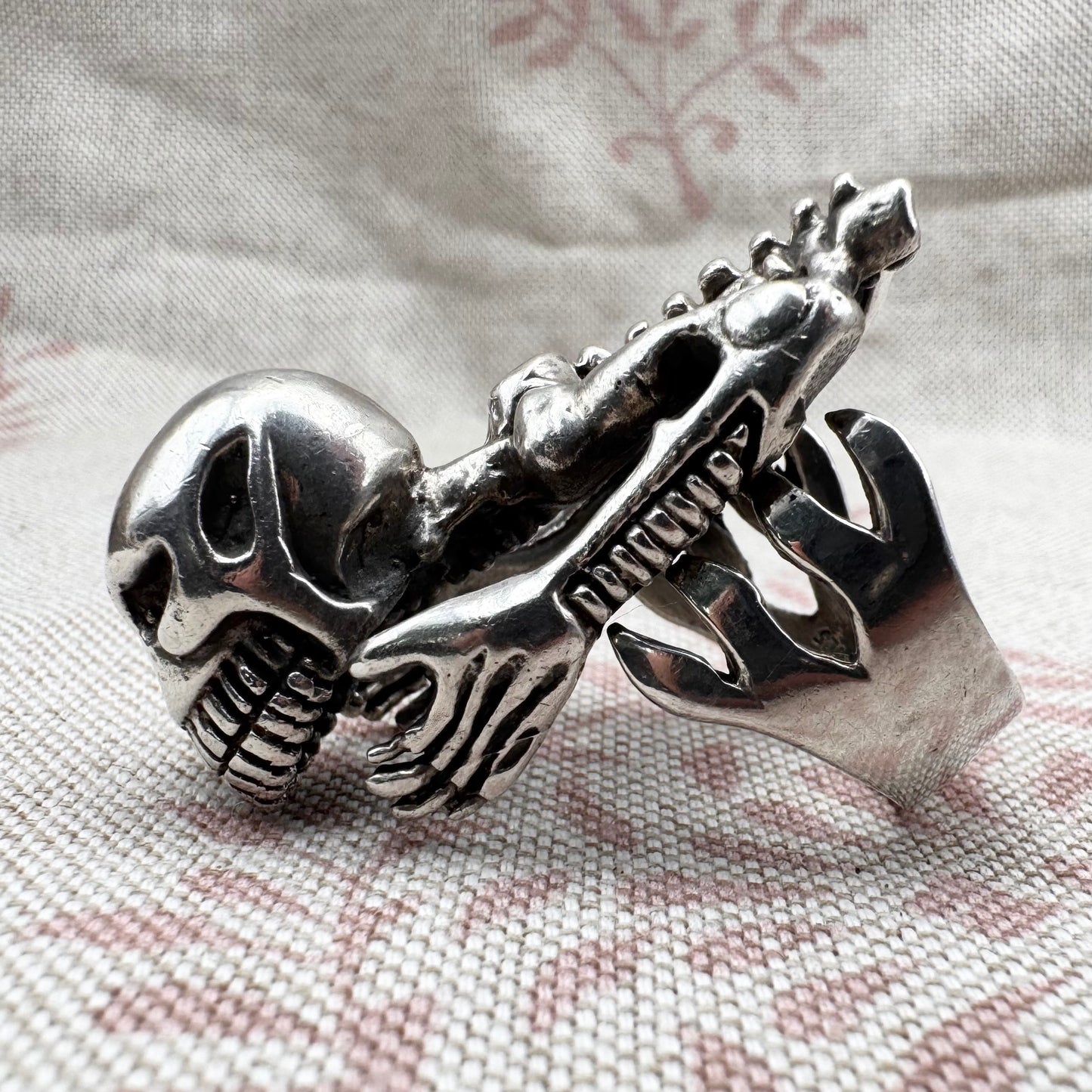 Skeleton ring with internal spine detail, size R (US 8.5) adjustable, hallmarked Birmingham