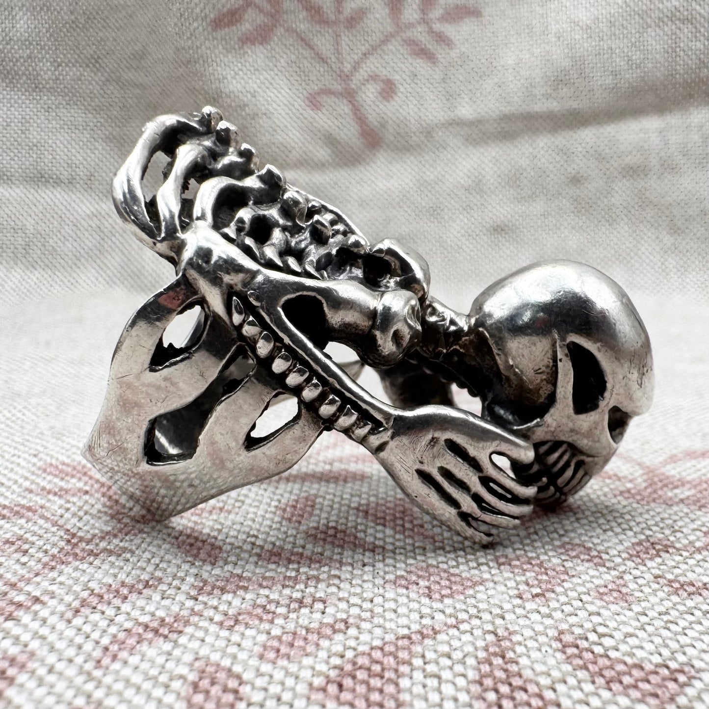 Skeleton ring with internal spine detail, size R (US 8.5) adjustable, hallmarked Birmingham