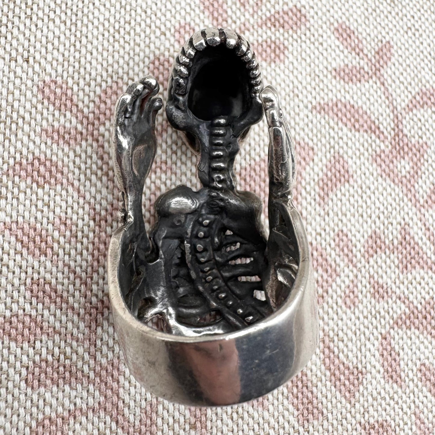 Skeleton ring with internal spine detail, size R (US 8.5) adjustable, hallmarked Birmingham