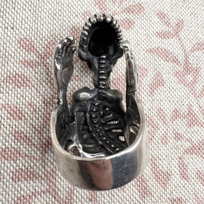 Skeleton ring with internal spine detail, size R (US 8.5) adjustable, hallmarked Birmingham