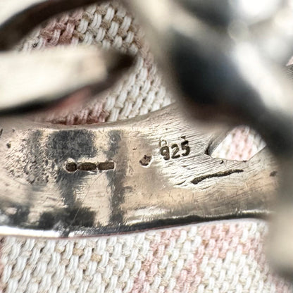 Skeleton ring with internal spine detail, size R (US 8.5) adjustable, hallmarked Birmingham