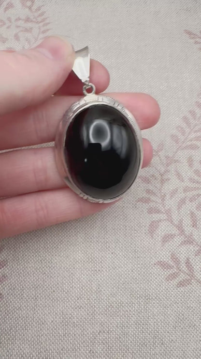 Large silver and black onyx pendant