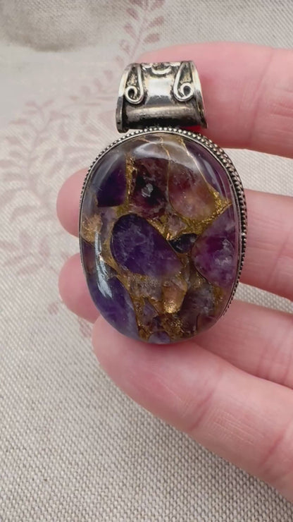 Chunky silver pendant with purple composite stone
